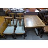 An oak barleytwist fold over pastry table and four chairs