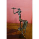 A contemporary bronze figure of a flautist