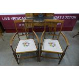 A pair of Edward VII inlaid mahogany elbow chairs