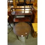 An oak circular sewing table and a folding bookcase