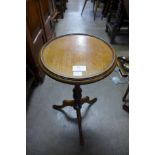 A mahogany tripod wine table