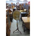 A Victorian mahogany and silk embroidered pole screen