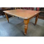 A Victorian walnut dining table