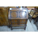 An oak geometric moulded bureau