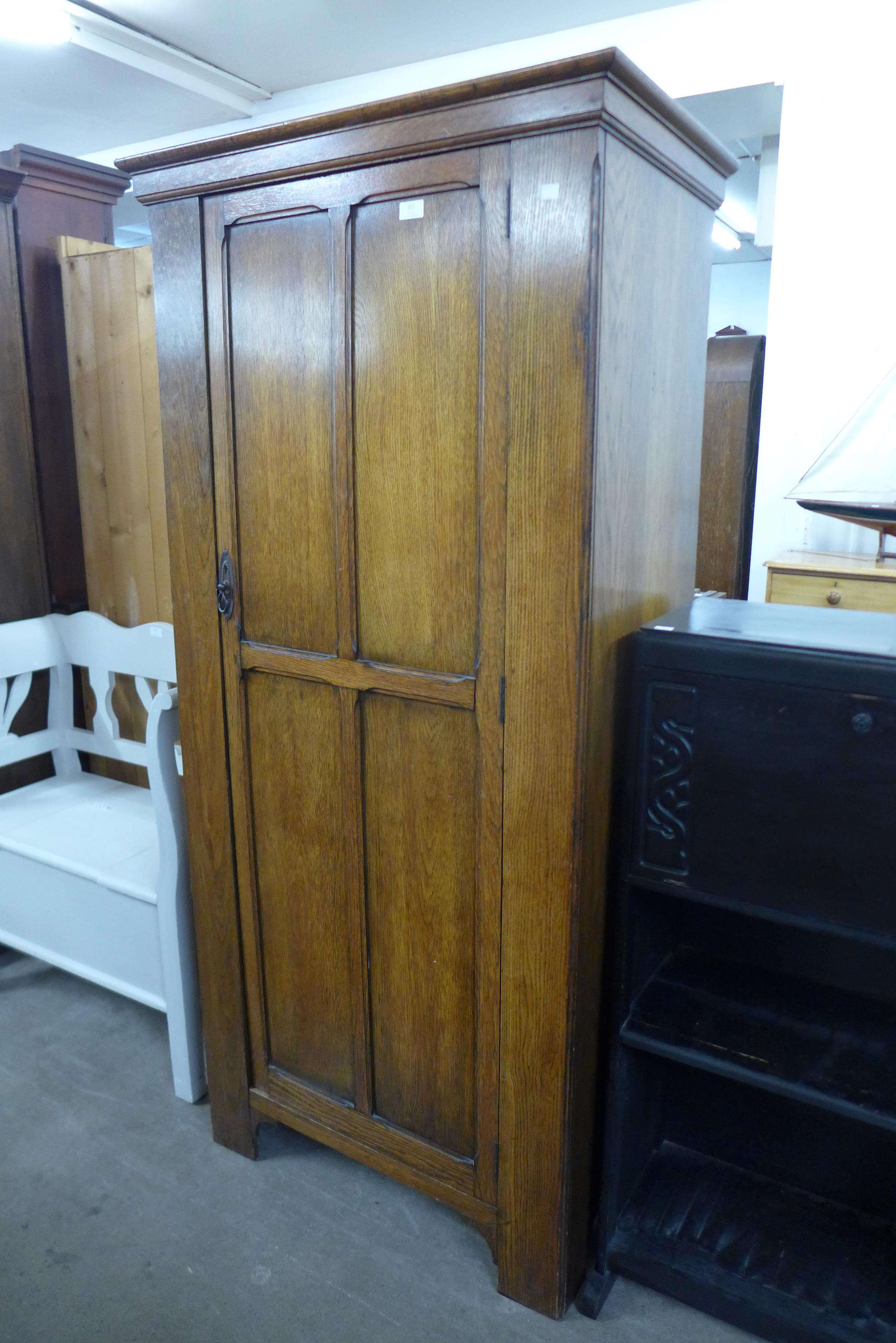 An oak single door wardrobe