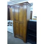 An oak single door wardrobe