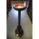 A carved oak smokers stand