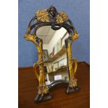 An Art Nouveau style gilt framed dressing table strut mirror