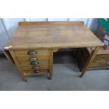 An oak writing desk with side drop leaf