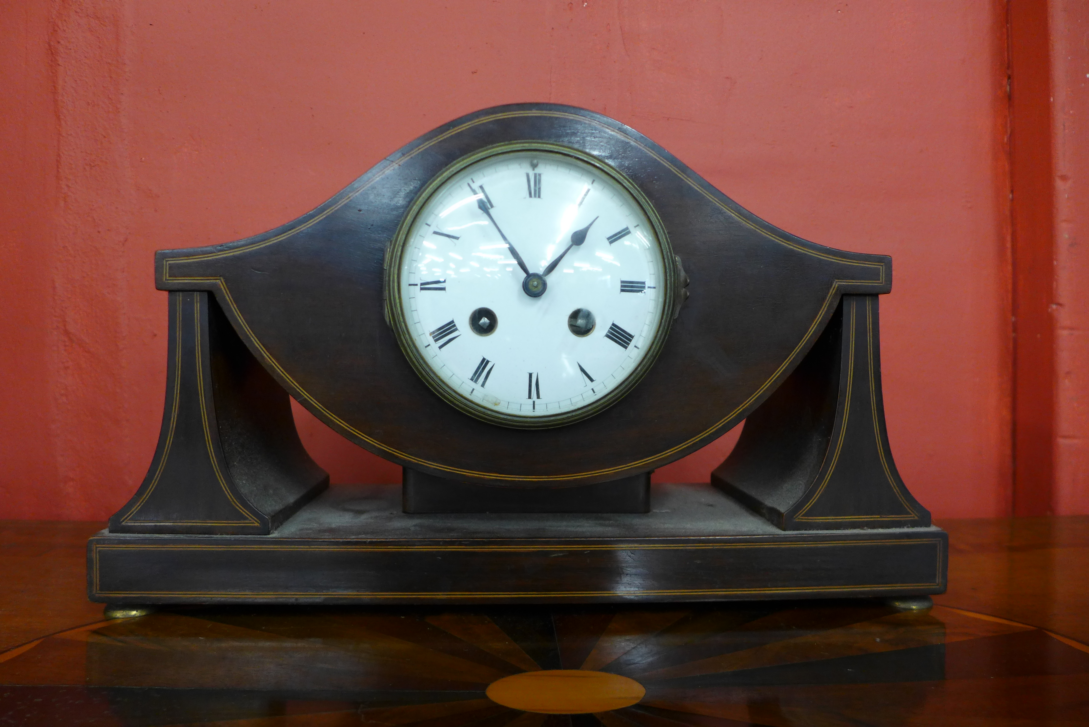 A French Art Nouveau inlaid mahogany timepiece