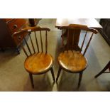 A pair of Victorian beech penny seat kitchen chairs