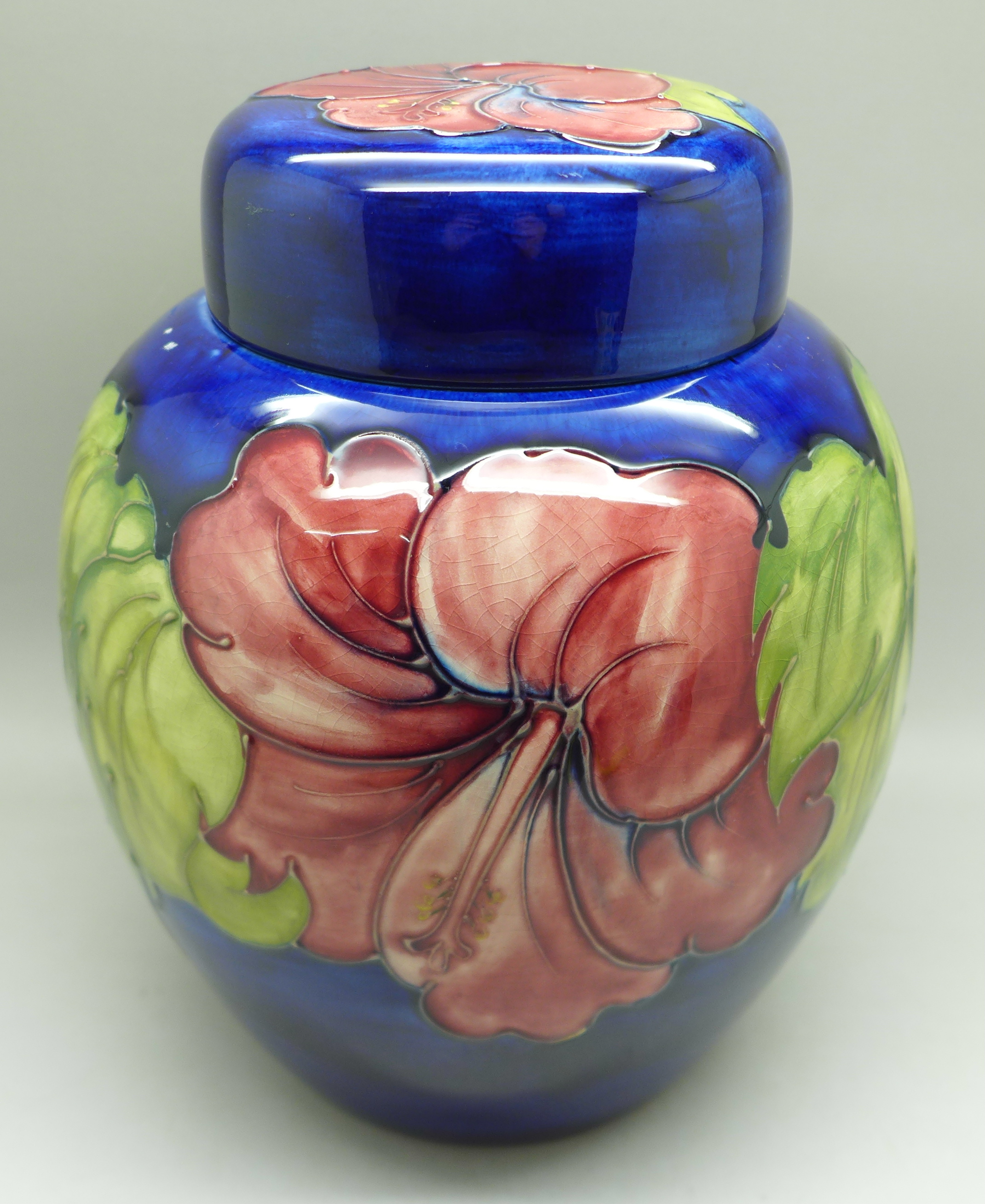 A Moorcroft hibiscus ginger jar on blue ground, signed, with paper label inside lid, 20cm - Image 4 of 9