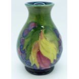 A Moorcroft Leaves and Fruit vase, with impressed signature and Potter to H.M. The Queen marks, 9cm