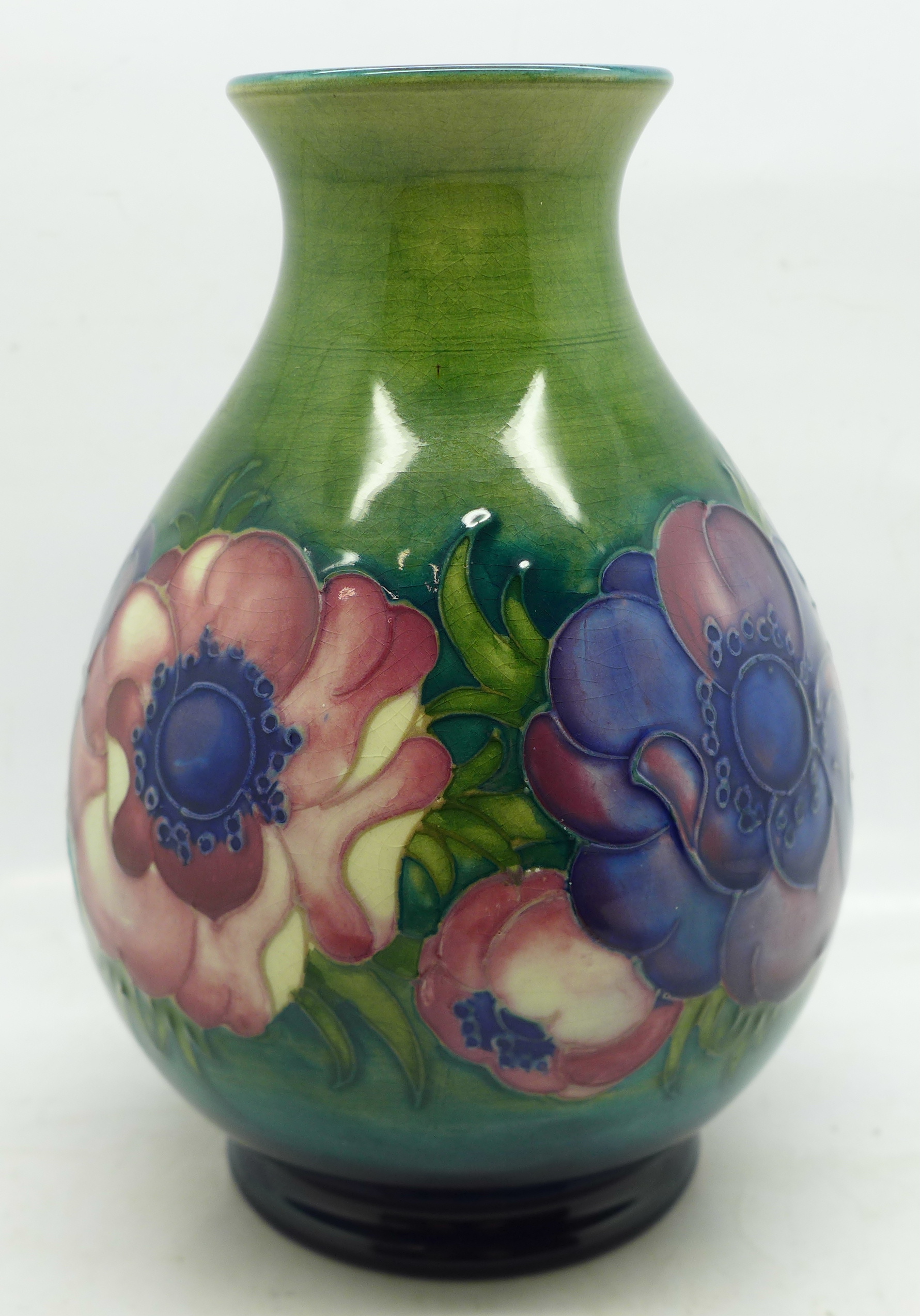 A Moorcroft anemone vase, signed and with paper label, H.M. Queen Mary, 15cm