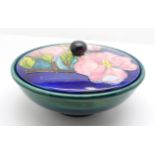 A Moorcroft lidded bowl, blue/green bowl and blue lid, with impressed signature and Potter to H.M.