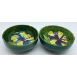 Two small Moorcroft hibiscus bowls, both with 1965 Montreal back-stamps, 8cm diameter