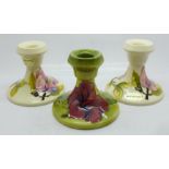 Three Moorcroft candlesticks, height 83mm, (132, 133, 134)