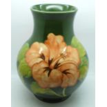 A Moorcroft hibiscus vase, signed and with 1972 Centenary mark to the base, 23cm