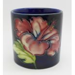 A small Moorcroft hibiscus cylindrical pot, with paper label, The Late Queen Mary, height 57mm