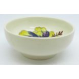 A small Moorcroft hibiscus bowl, with paper label, The Late Queen Mary, 8cm diameter