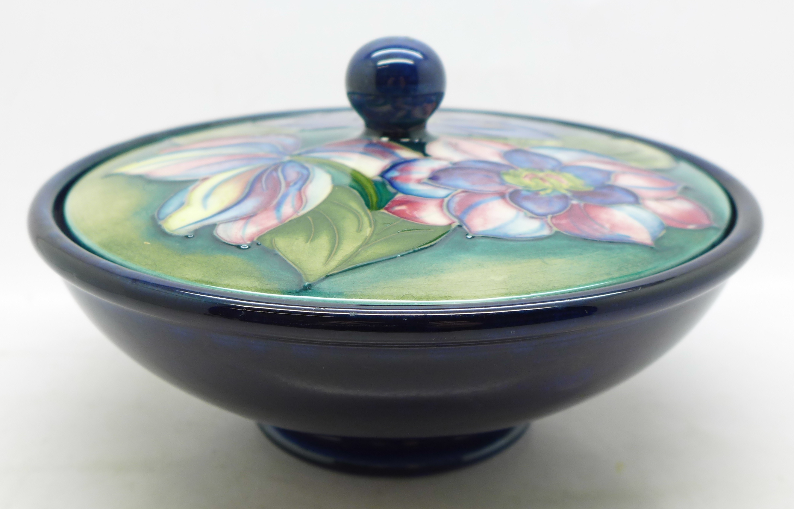 A Moorcroft lidded bowl, with impressed marks, 15cm diameter