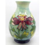 A Moorcroft Columbine pattern vase, 18.5cm