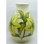 A Moorcroft Bermuda Lily vase, with paper label, The Late Queen Mary, 18.5cm, crazed