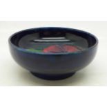 A small Moorcroft pansy bowl, with impressed signature and To H.M. The Queen mark, 77mm diameter
