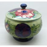 A Moorcroft anemone lidded pot, 12.5cm diameter