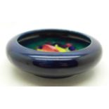 A Moorcroft Leaves and Fruit dish, with impressed signature, 109mm diameter, a/f