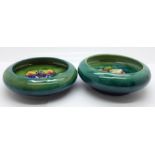 Two Moorcroft dishes, orchid and clematis, crazed, 112mm diameter, (150,210)
