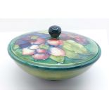 A Moorcroft lidded bowl, with impressed signature and Potter to H.M. The Queen mark, 157mm diameter,