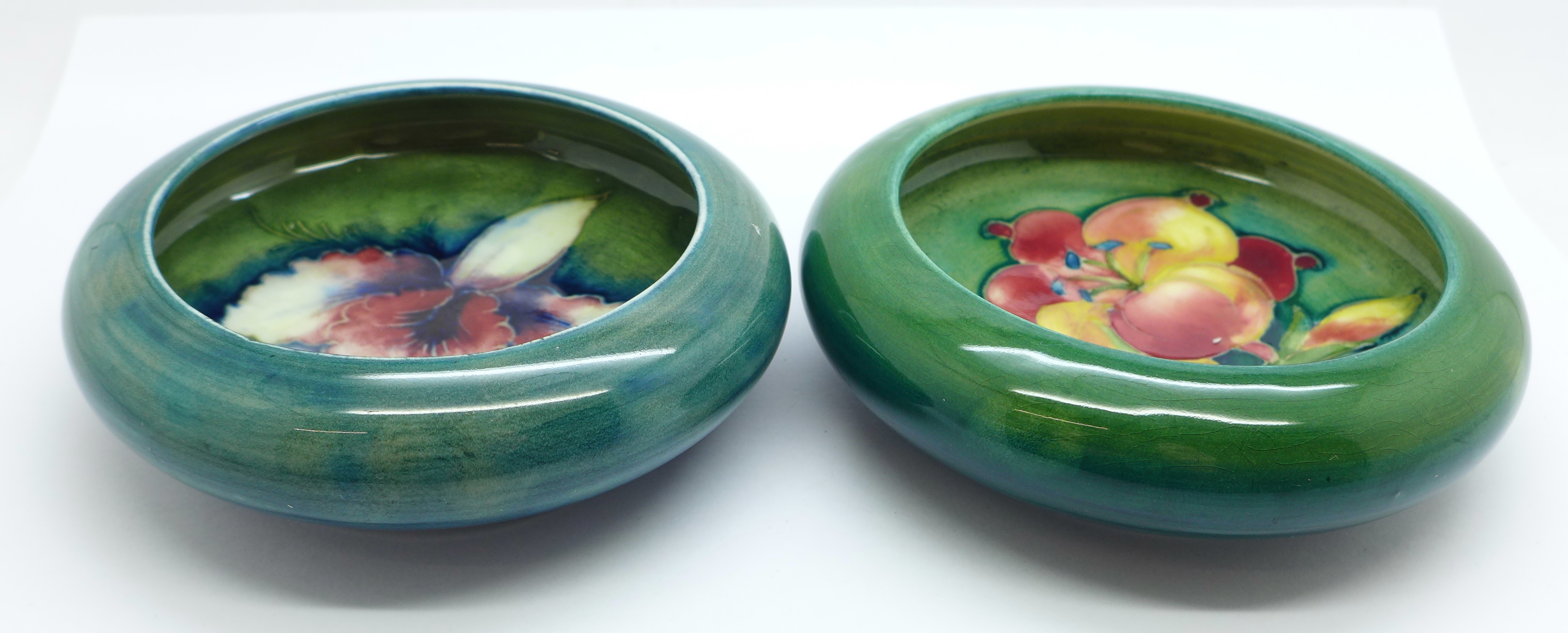 Two Moorcroft dishes, freesia and orchid, 11cm and 10.5cm, (142,146)
