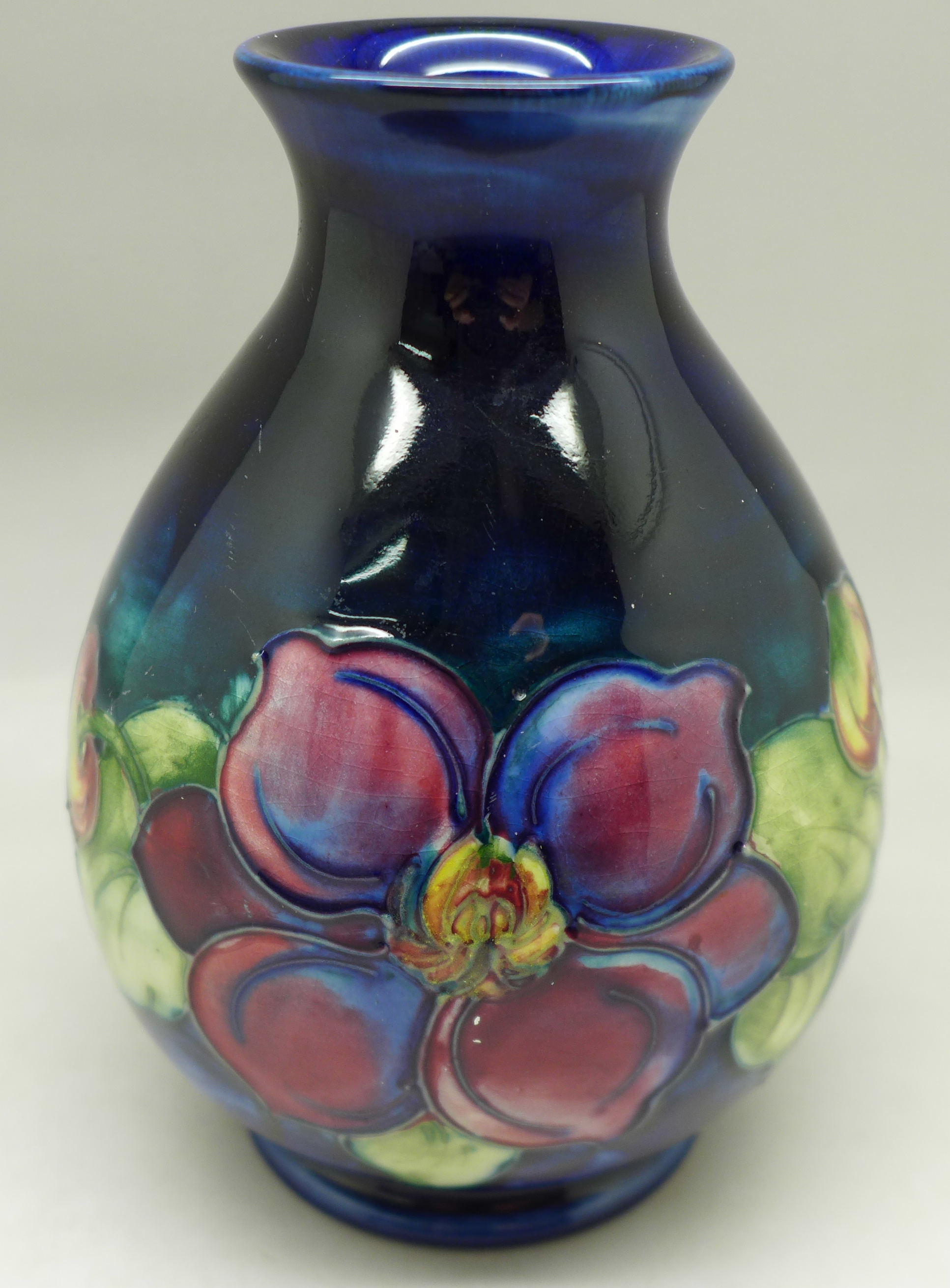 A Moorcroft clematis vase, with paper label, The Late Queen Mary, 13cm