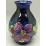A Moorcroft clematis vase, with paper label, The Late Queen Mary, 13cm