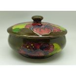 A Moorcroft hibiscus lidded pot, 11.5cm diameter