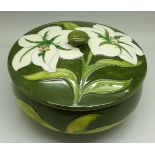 A Moorcroft Bermuda Lily lidded pot, with paper label, The Late Queen Mary, 138mm diameter