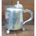 A Victorian silver ice bucket on three ball and claw feet, with lid and handle, possibly London