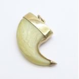 A yellow metal mounted claw pendant, (tests as 9ct gold), gross weight 4.9g