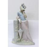 A large Lladro figure of a lady with parasol, 37cm