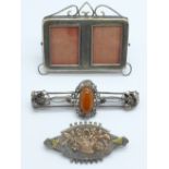 A Victorian silver brooch, one other brooch and a small silver double photograph frame