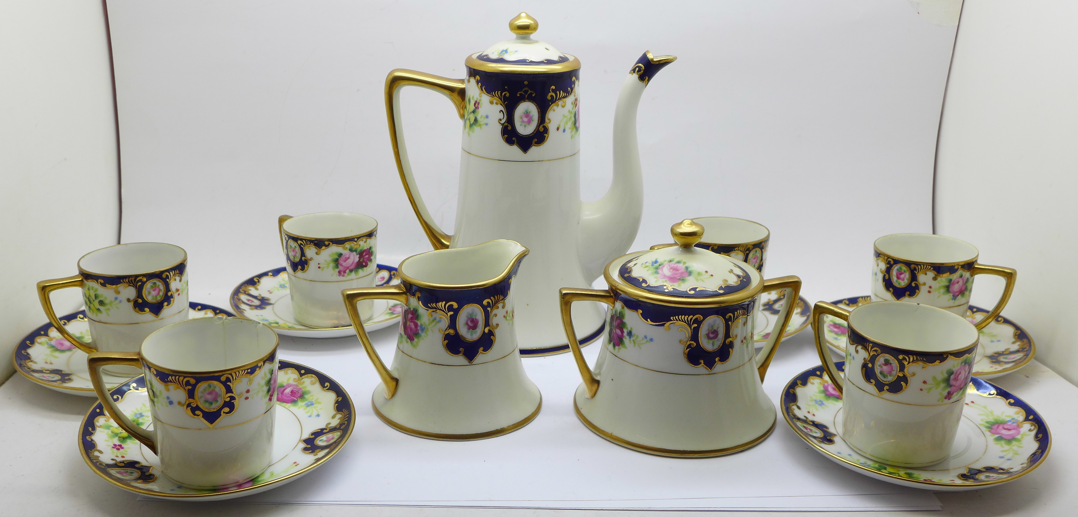 A Kokura Japanese six setting coffee set with cream and sugar, three coffee cans a/f