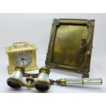A pair of French brass and mother of pearl opera glasses with handle, marked Monte-Carlo Aix-Les-
