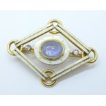 An 18ct gold, cabochon blue stone, diamond and enamel brooch, marked on the pin, 31mm x 41mm, 11g