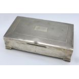 A silver cigarette box, (with inscription dated 1962, dented), 356.5g gross weight, 148mm