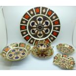 A Royal Crown Derby 1128 dinner plate, cup and saucer, two pin trays and a small dish