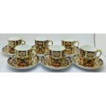 A set of six Royal Crown Derby 2451 coffee cans and saucers