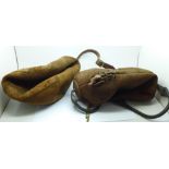 A mid-20th Century leather football and a boxing speed bag