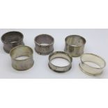 Six assorted silver napkin rings, 130g