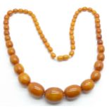 A set of butterscotch amber beads, 58.6g, largest bead 23mm